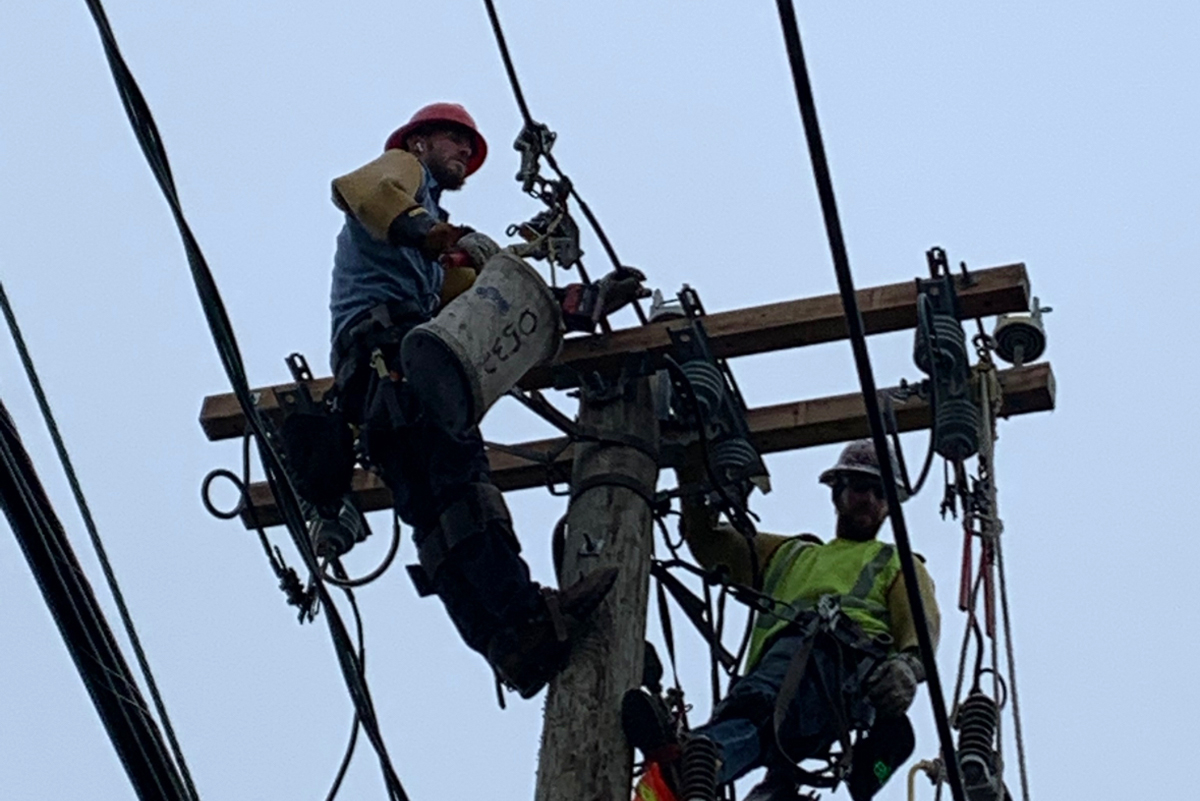Linemen working on power line